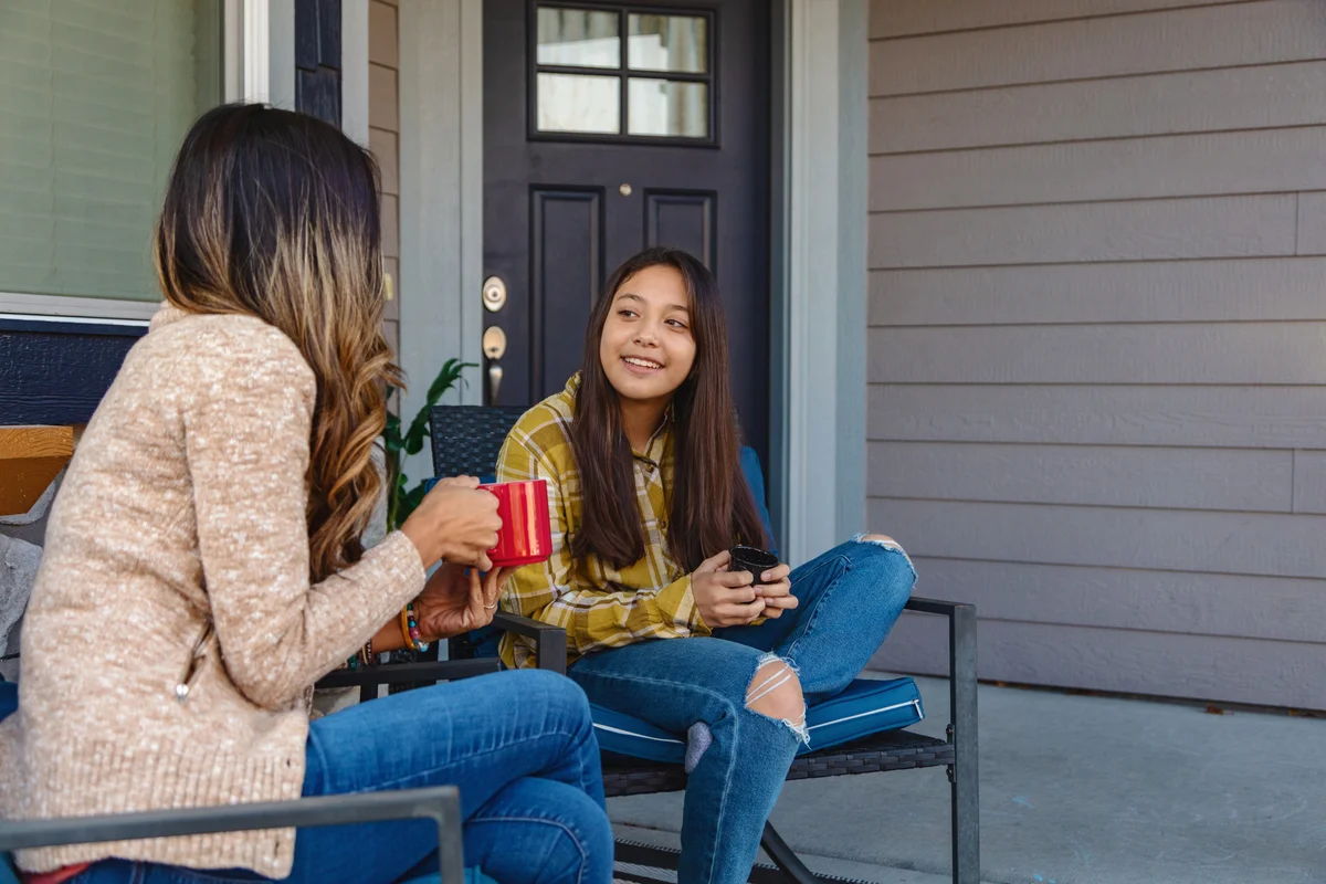 mom and preteen daughter talking