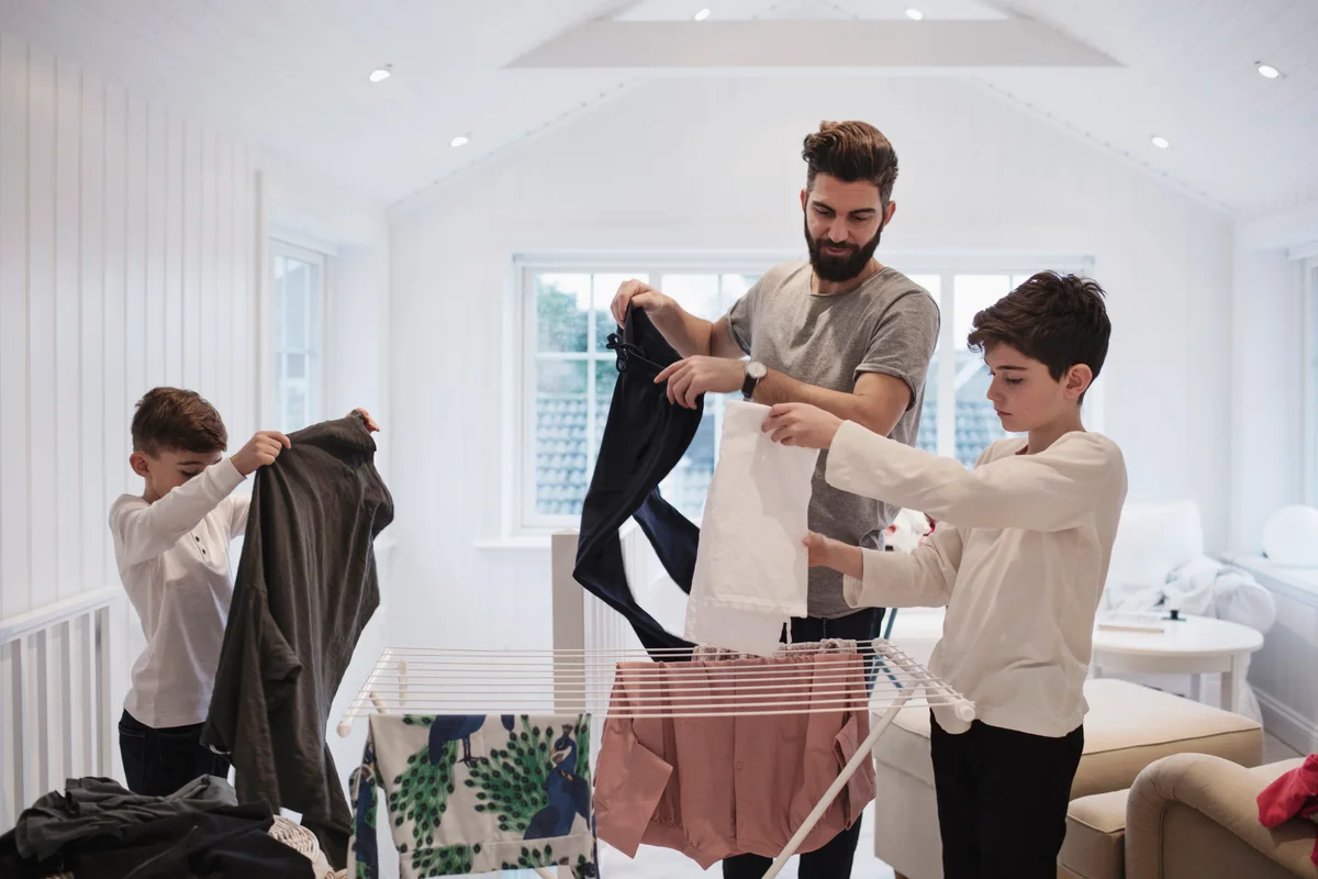 preteen kids doing laundry