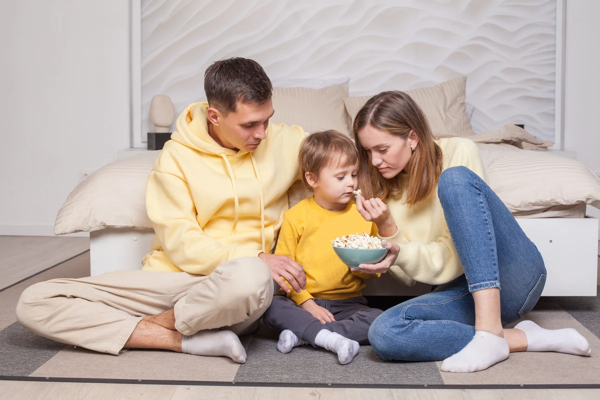 family looking at popcorn
