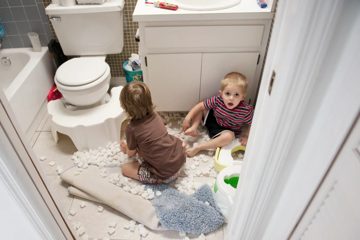 Boys making mess in bathroom