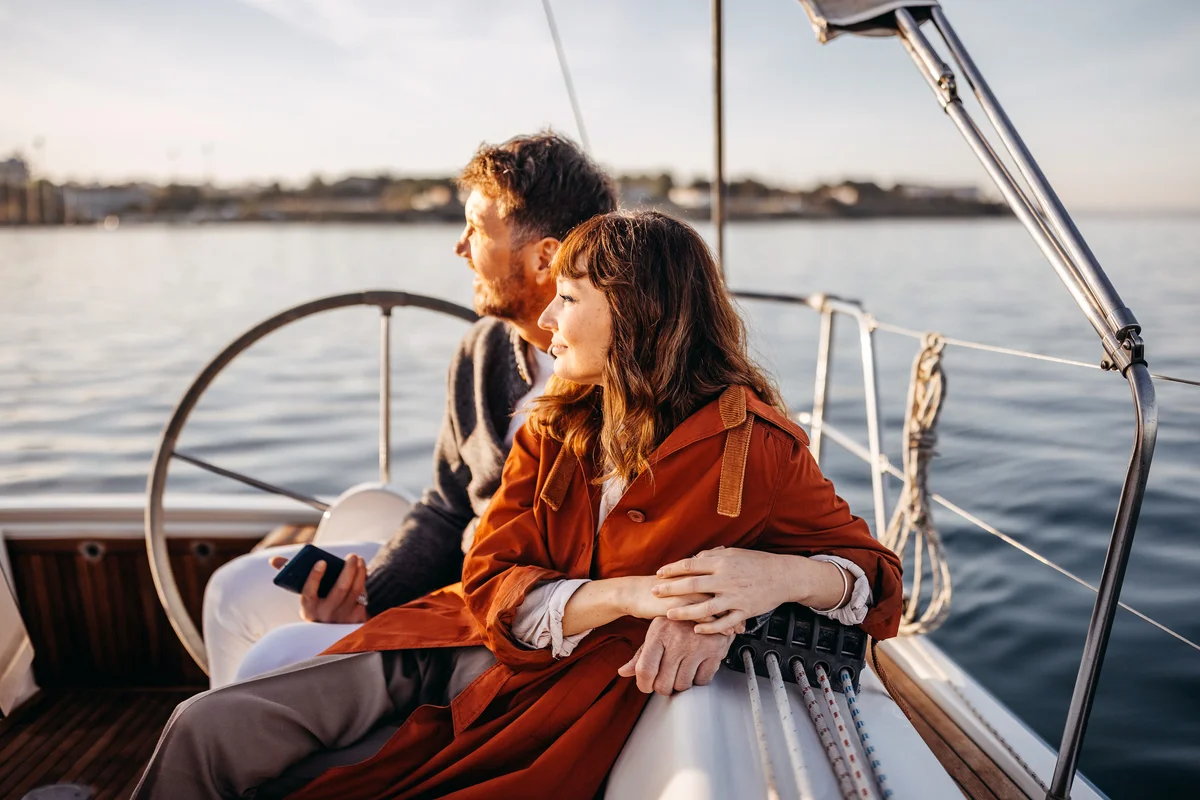 Couple enjoying their boat ride in Autumn