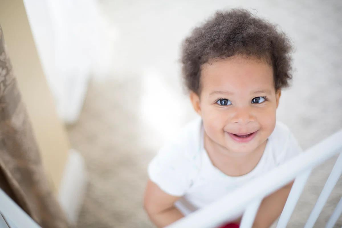 toddler by baby gate