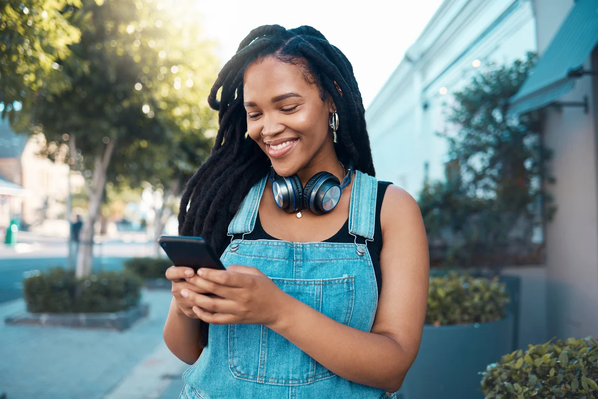 Woman typing a text message on her smartphone