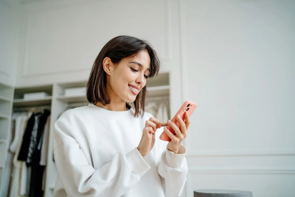 Young woman using phone