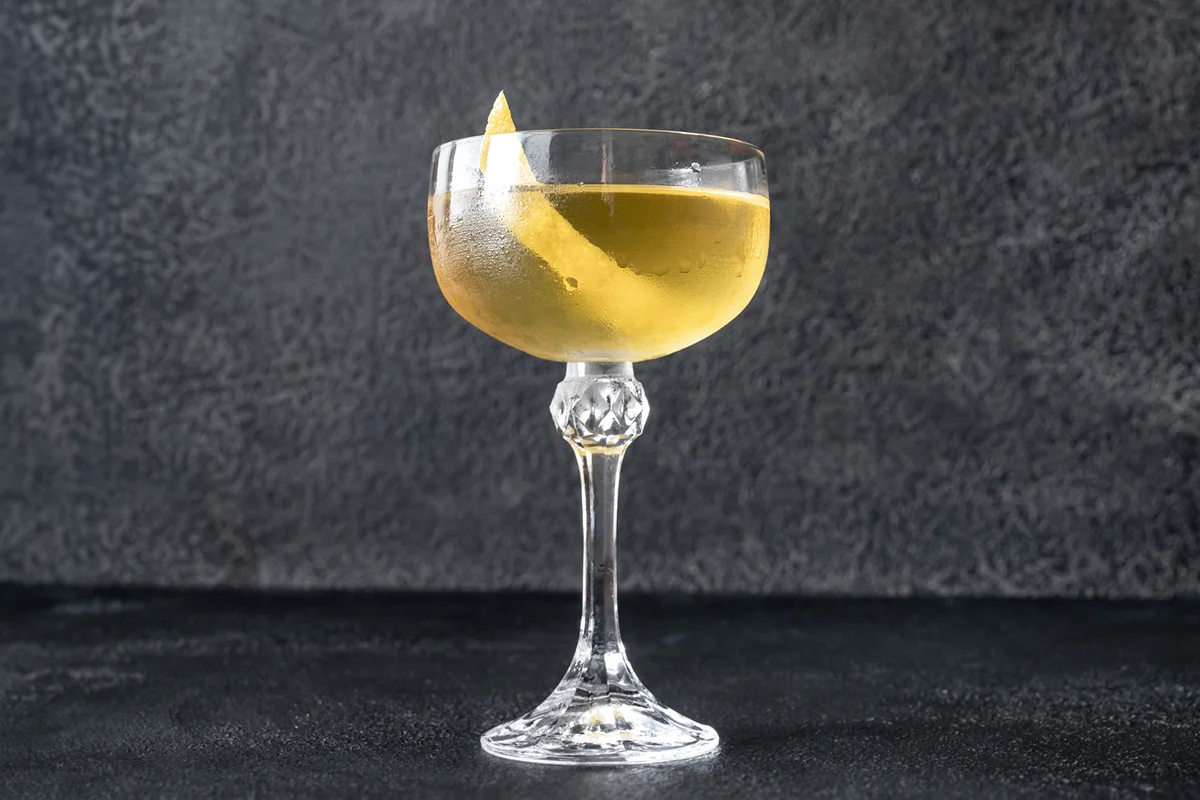 Glass of Alaska cocktail on the dark background