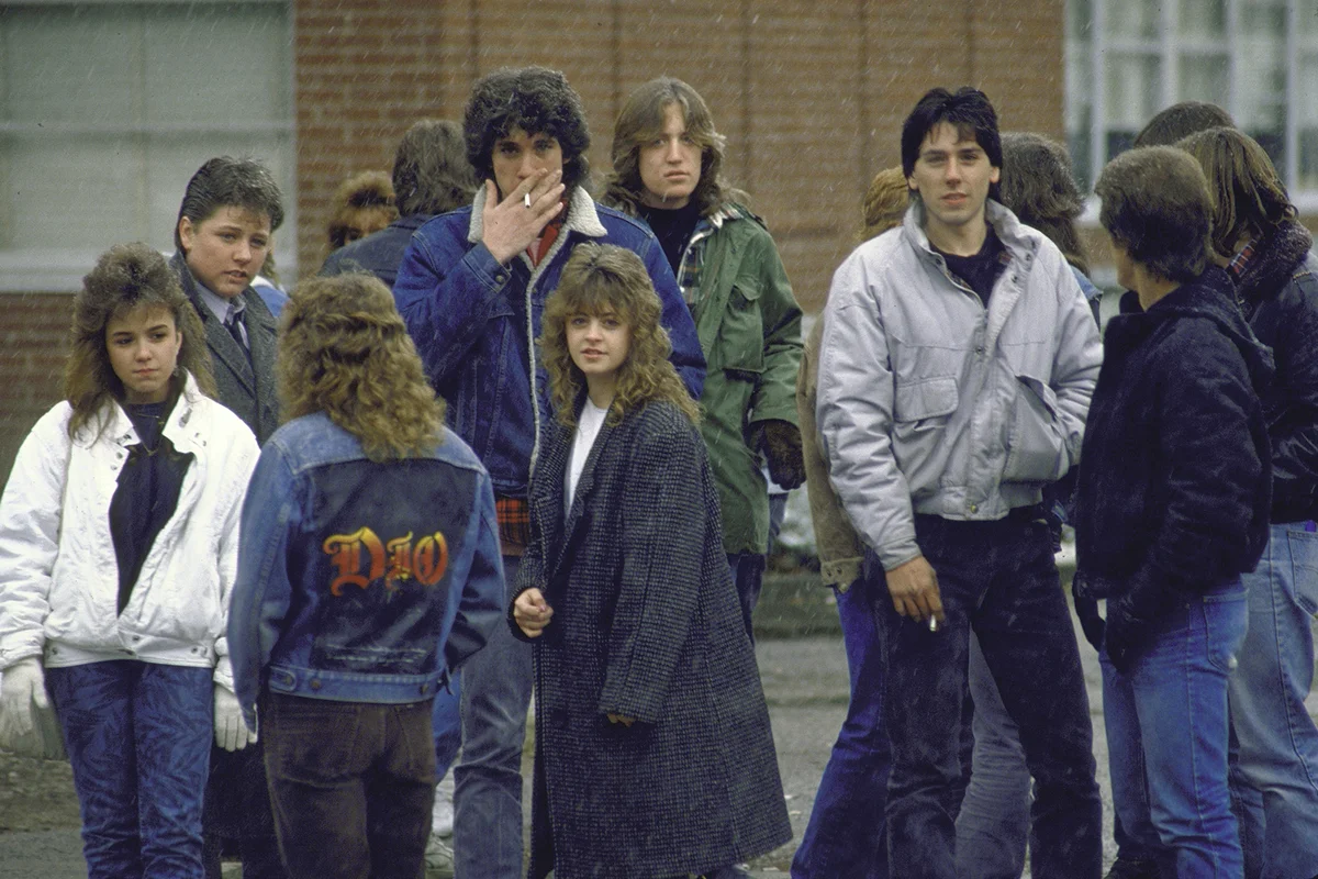 Groups of students in front of Bergenfield High School socializing