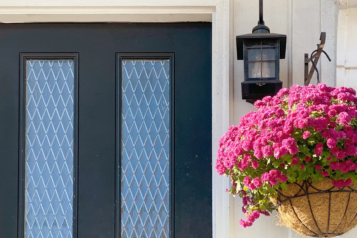 Front door with hanging chrysanthemums