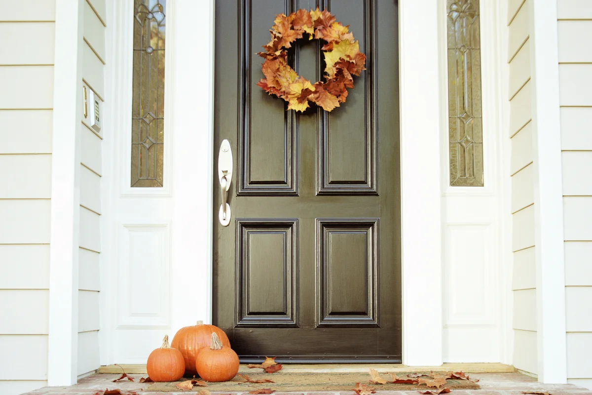 Pumpkins on front step of house
