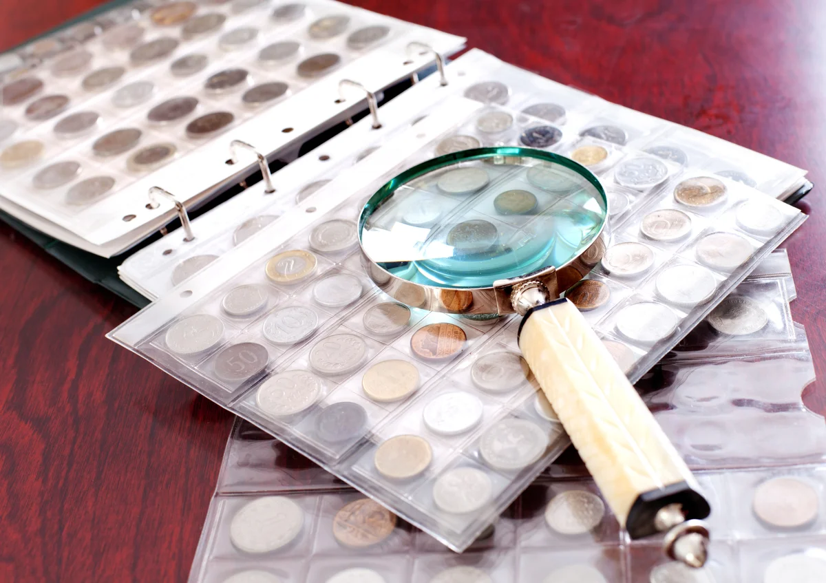 magnifying glass and coin collection