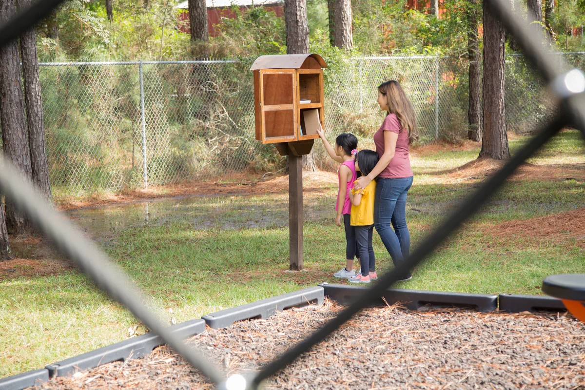 family visiting little library