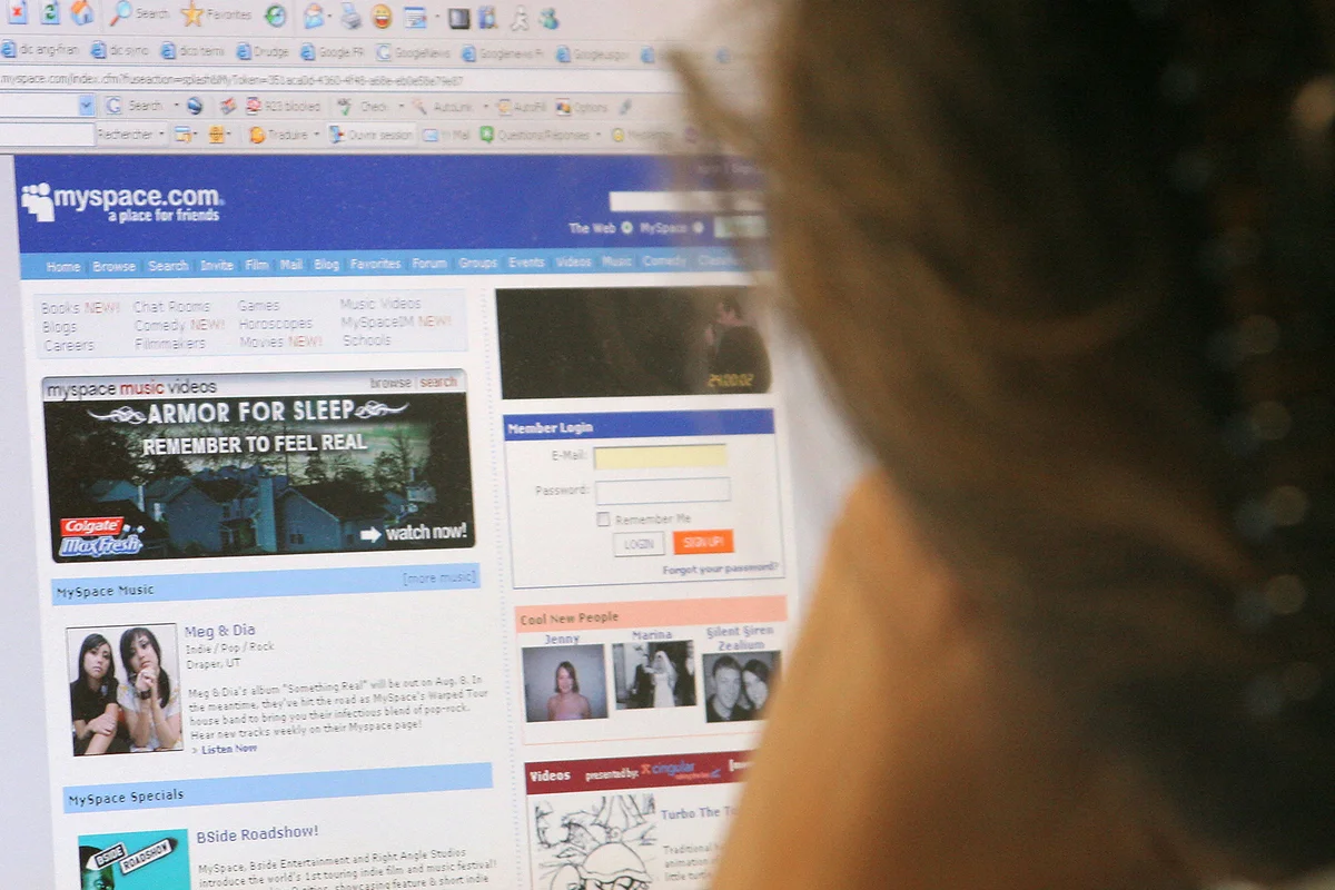A woman looks at the MySpace website