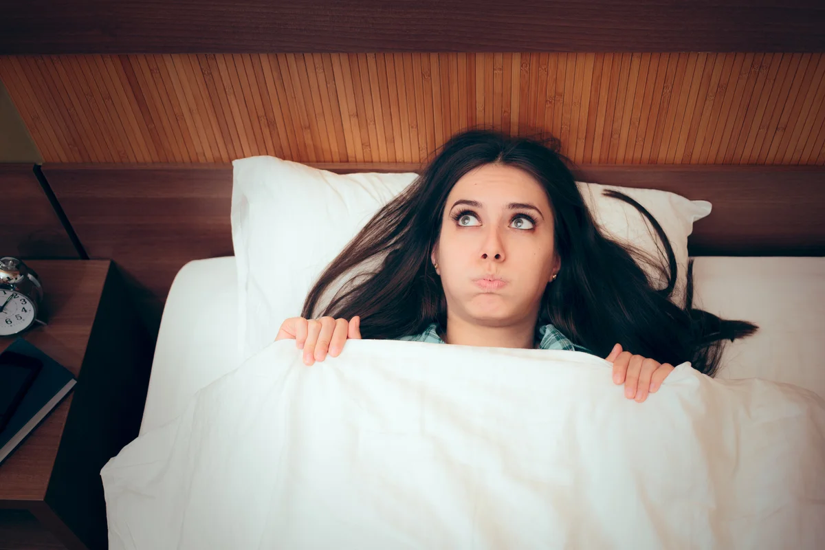 woman laying awake