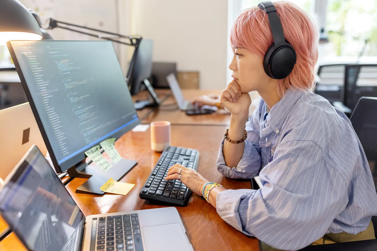 woman coding at computer