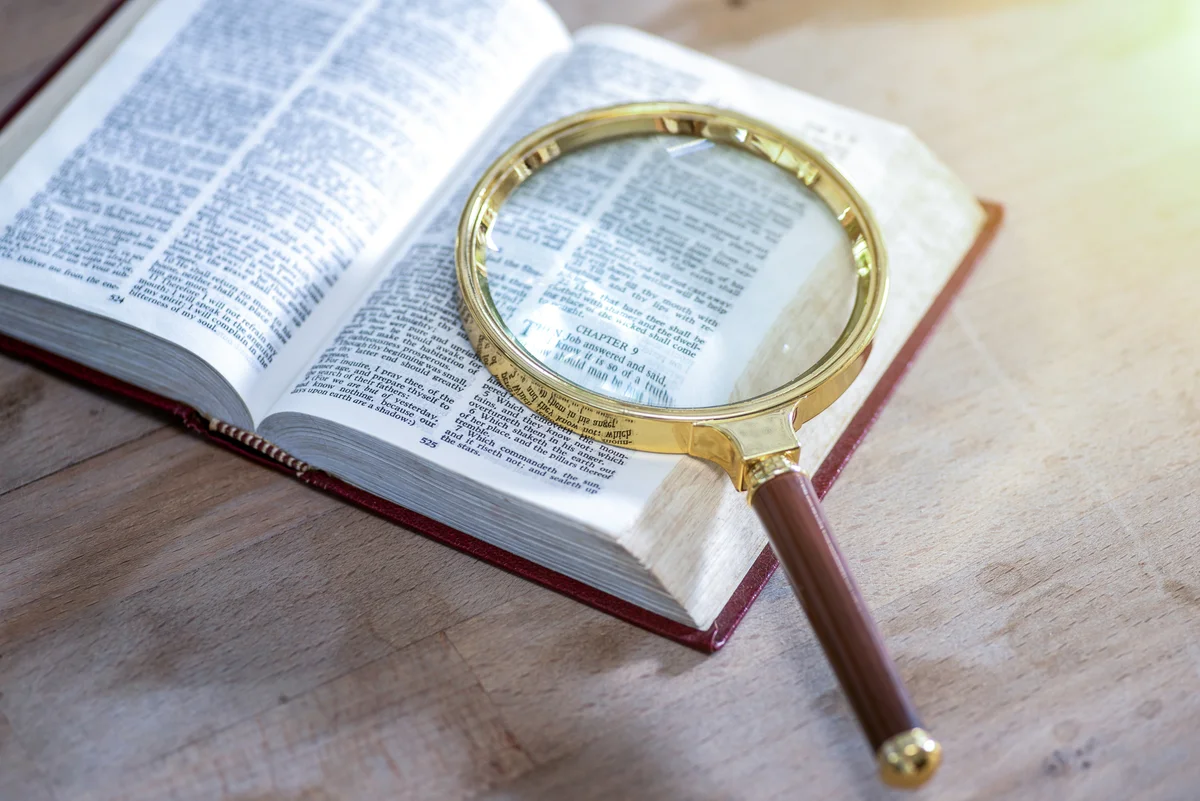 Magnifying glass on a dictionary