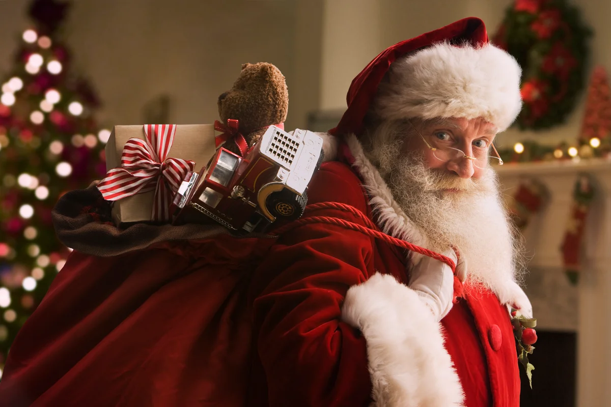 Santa carrying his bag