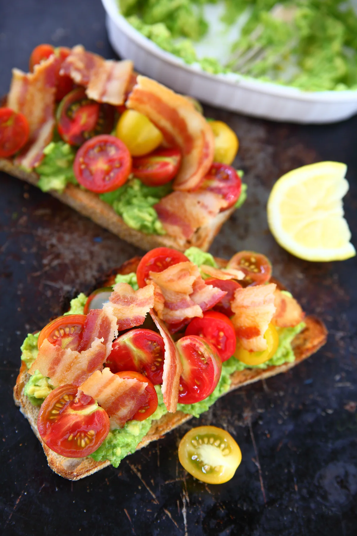 avocado toast with bacon and tomatoes