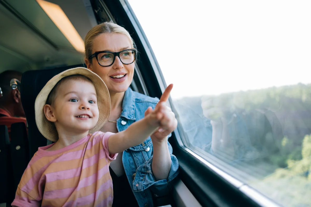 Mother And Daughter Having Fun While Riding On The Train Together