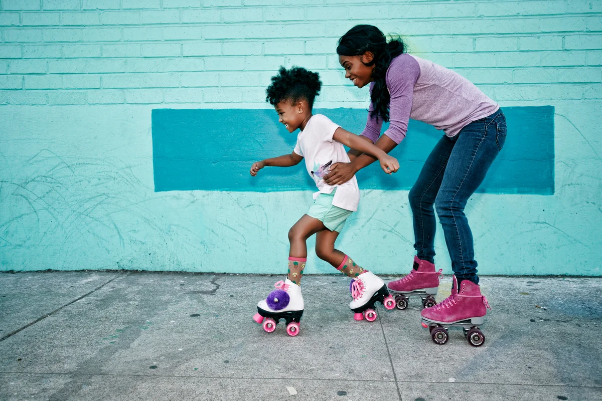 Mom and daughter roller skating