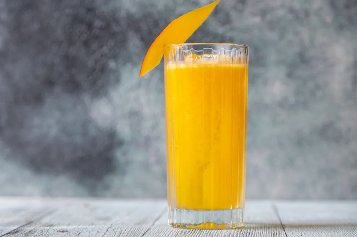 Orange rum drink in tall glass
