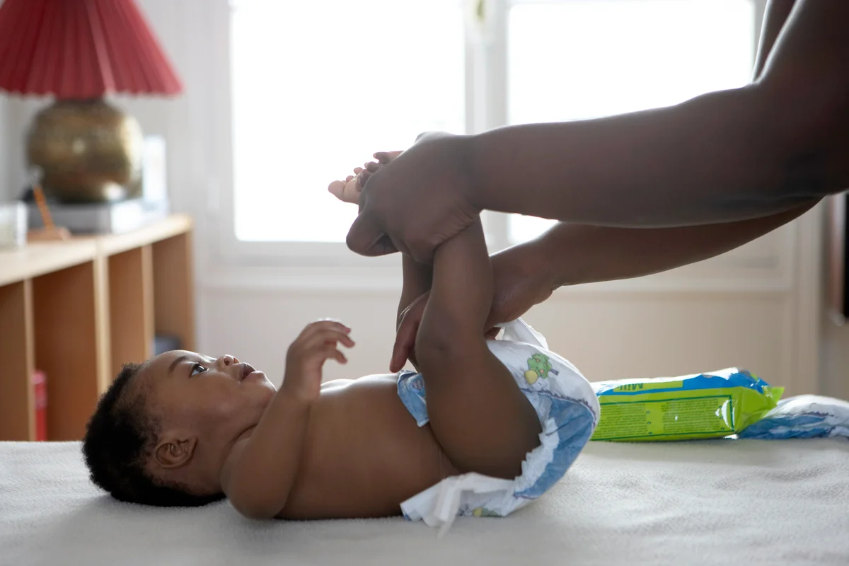 baby getting diaper changed