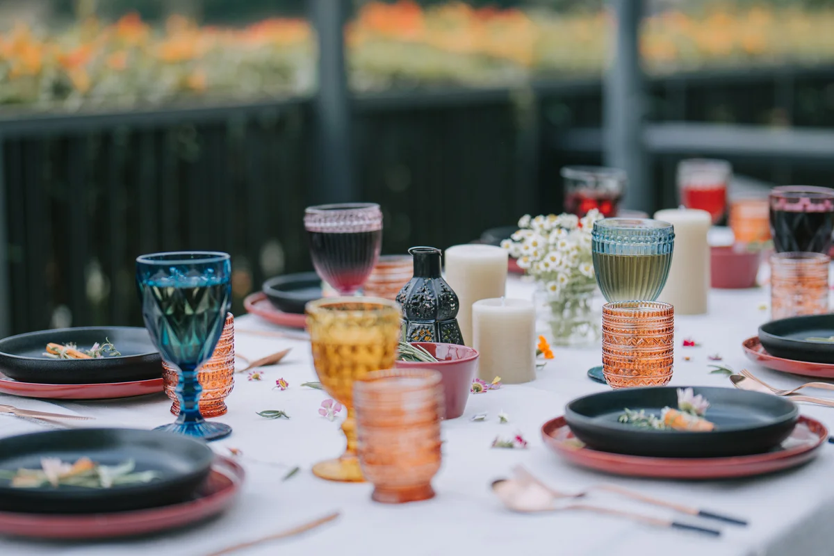 Mix and match colorful glassware on table