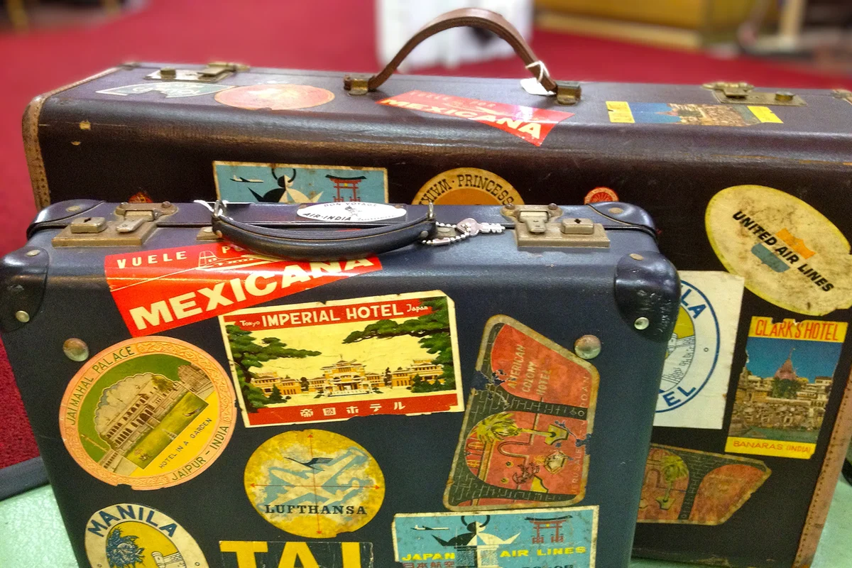 Two Leather Suitcases With Stickers