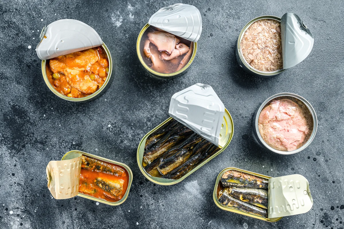 Assortment of cans with different types of fish and seafood