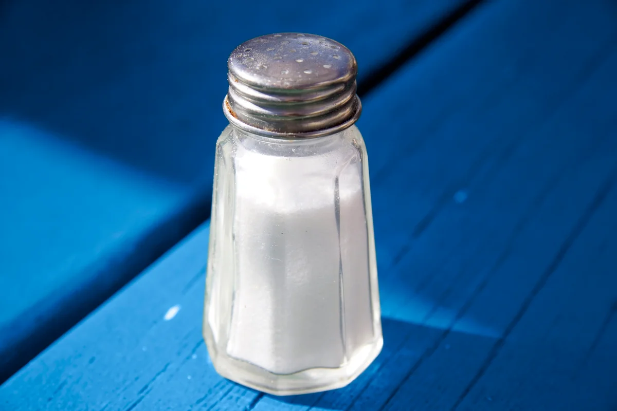Salt shaker on a blue table