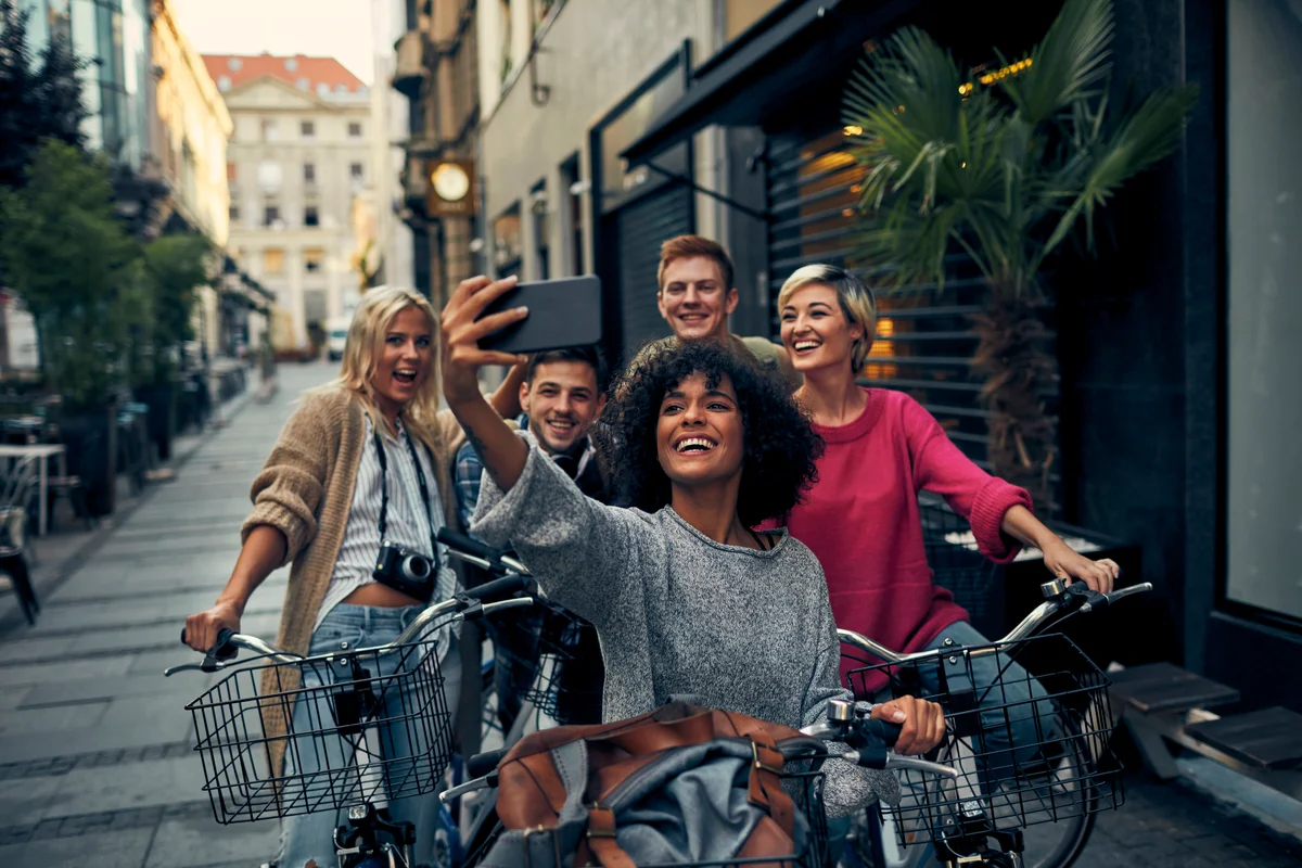 friends riding bikes in a city
