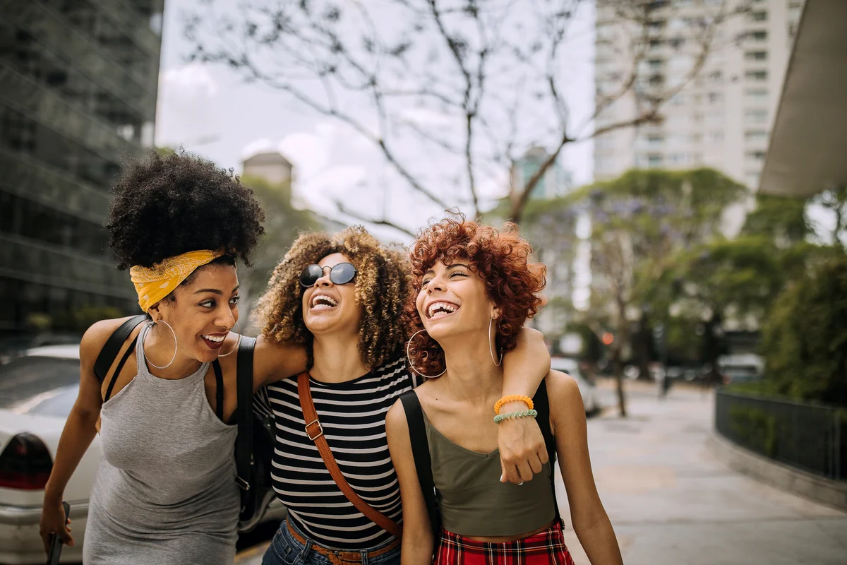 3 friends having fun in city
