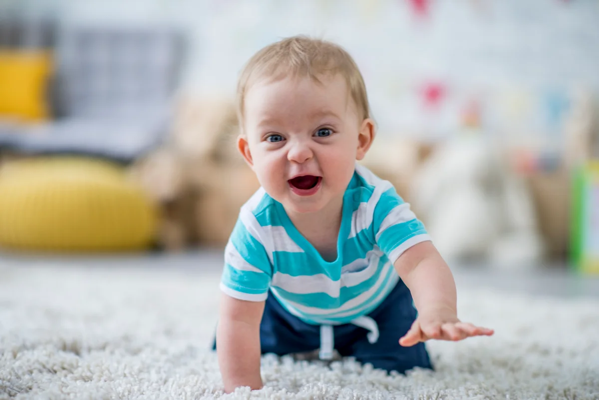 Baby boy learning to crawl