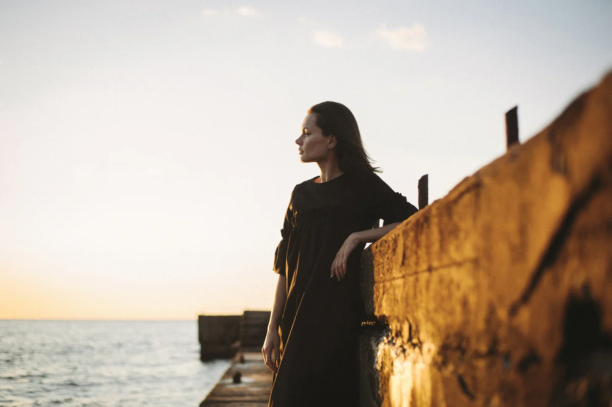 Woman gazing out to sea