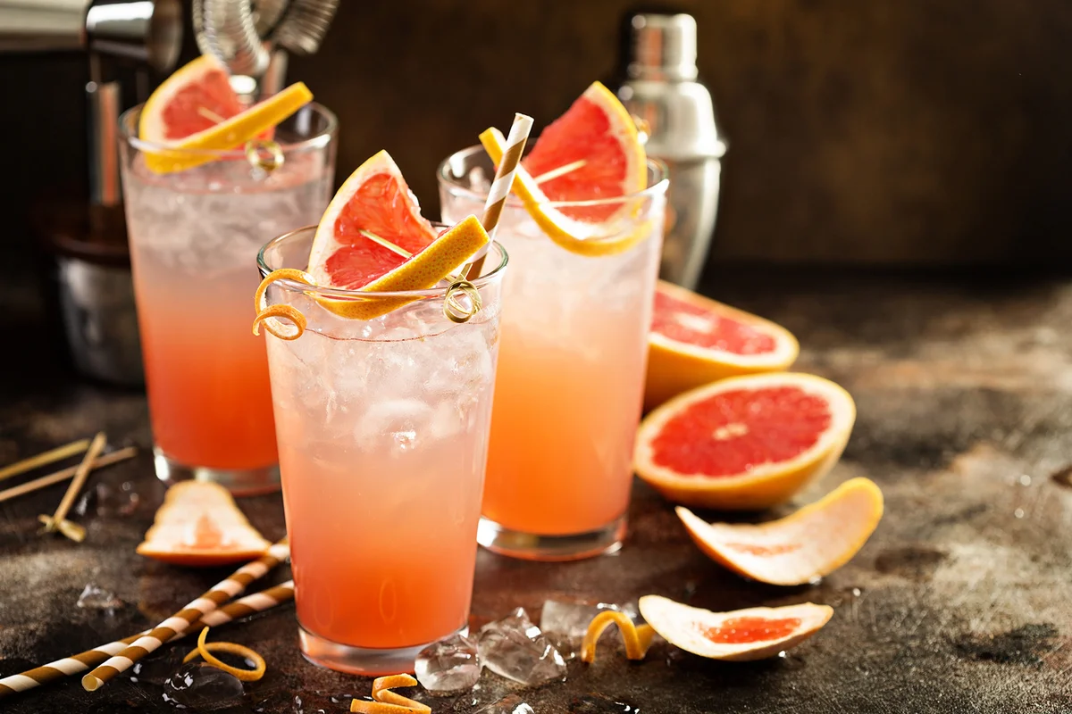 Grapefruit cocktail in tall glasses with ice and sparkling water
