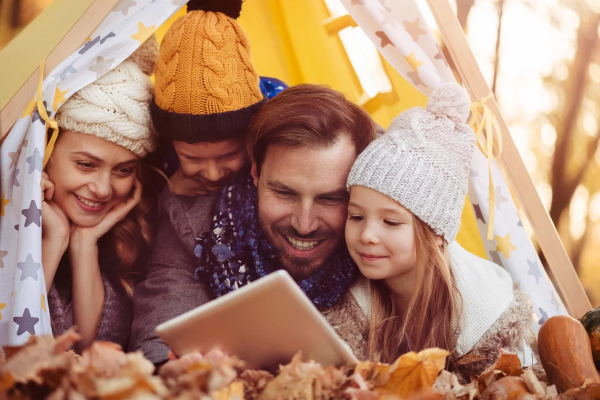 family watching a movie in fall