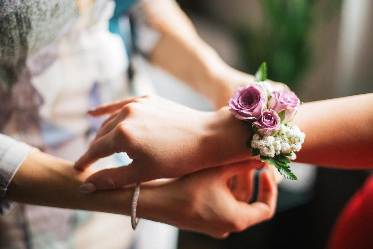 Friend puts corsage