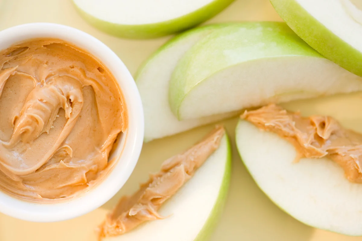 Peanut butter on sliced apple