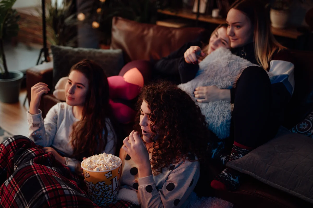 teen girls watching a movie
