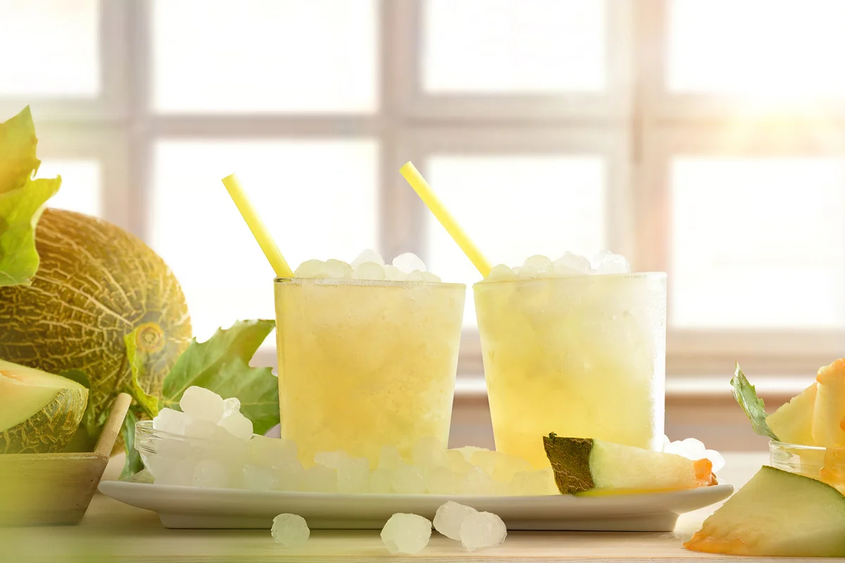 Two glasses with iced melon drink