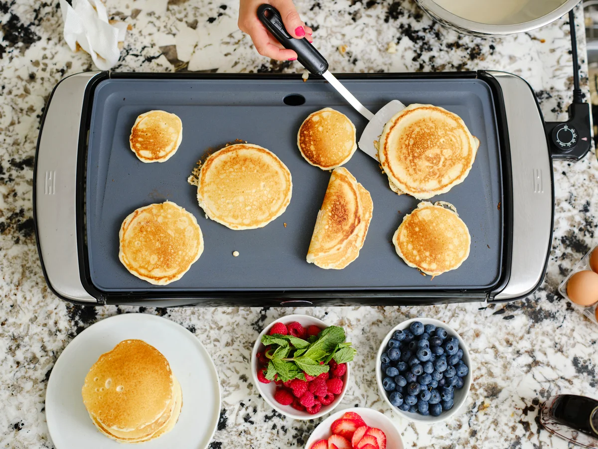 Woman cooking pancake breakfast