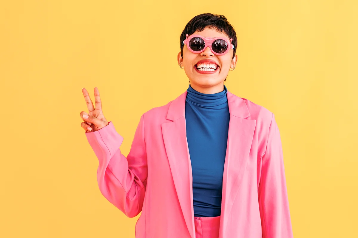 Playful young woman wearing sunglasses