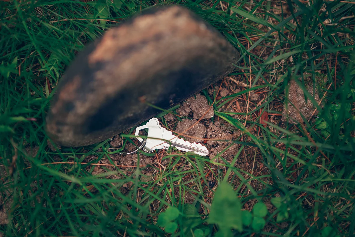 Hidden key, spare key, house key under rock