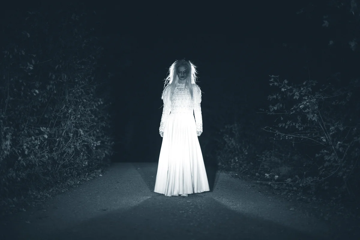 Scary woman dressed in white