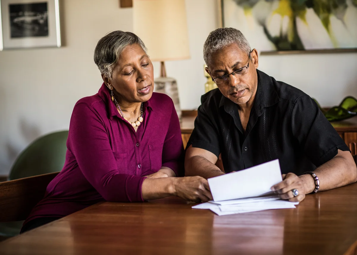 Senior couple figuring out their budget