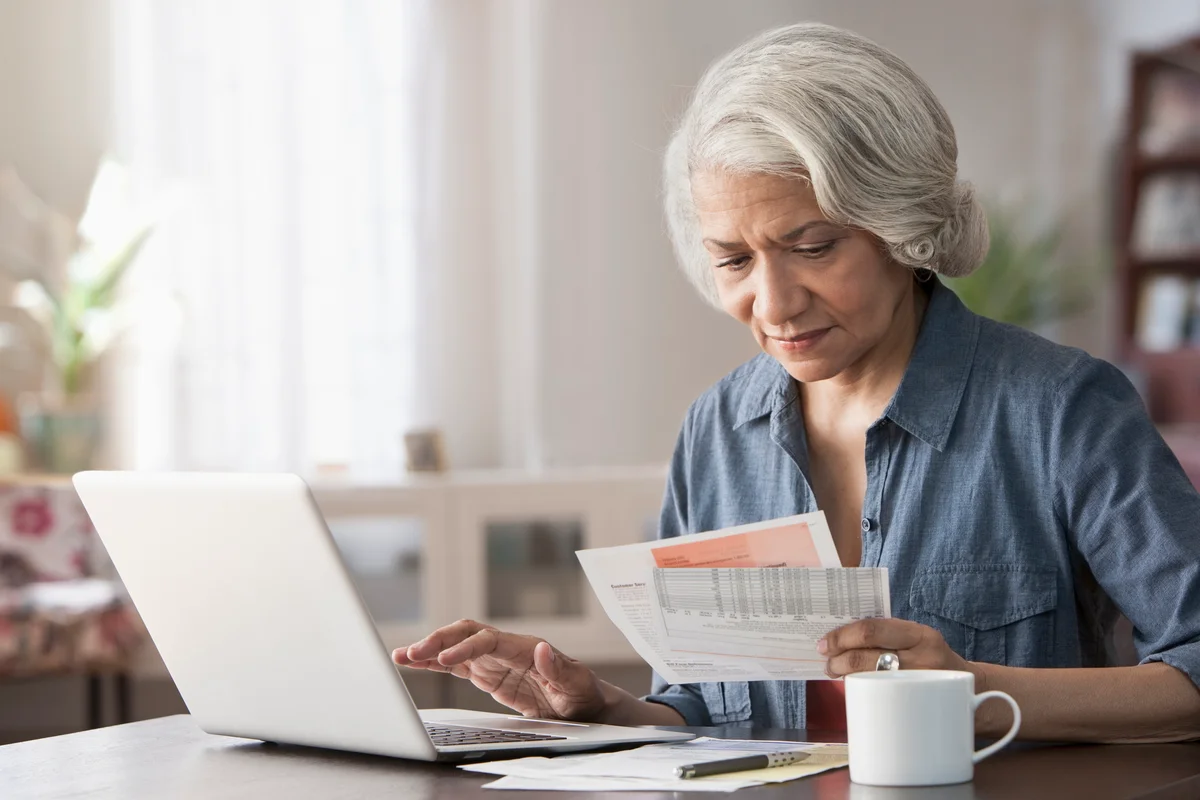 Older woman working on her budget