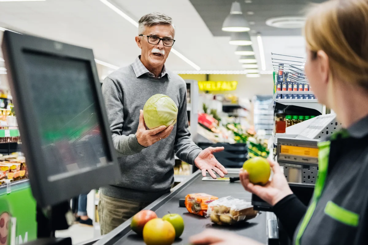 Older man grocery shopping