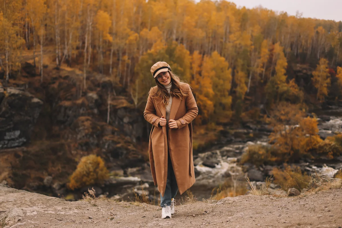 Trendy woman in fall weather wearing comfortable shoes