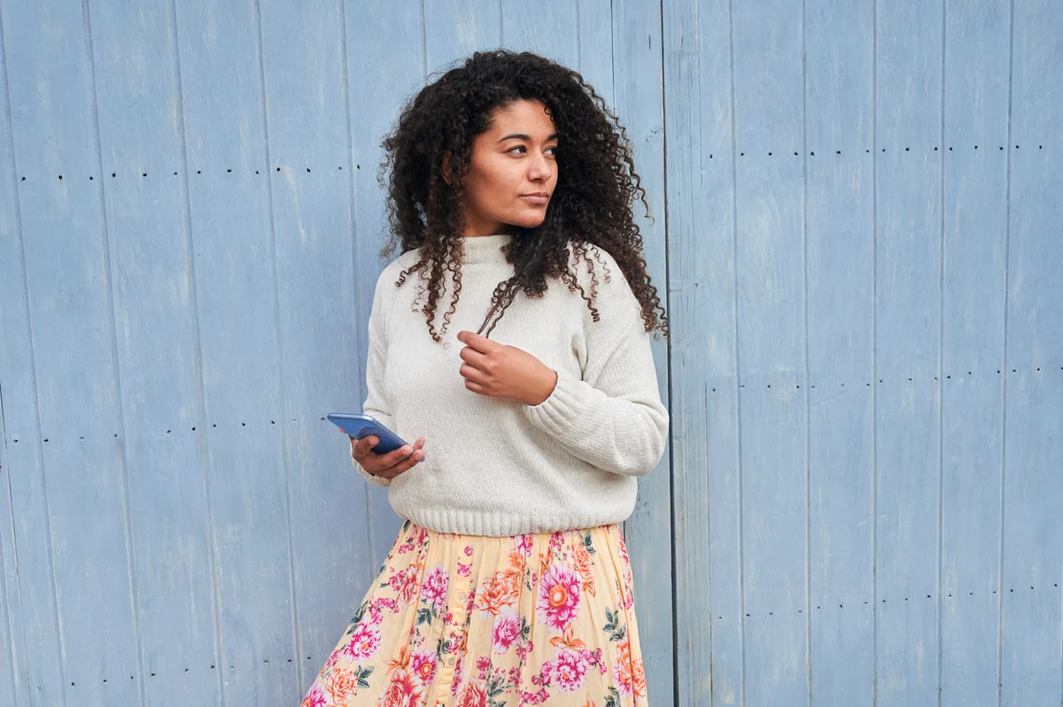 Woman wearing cozy sweater and maxi skirt