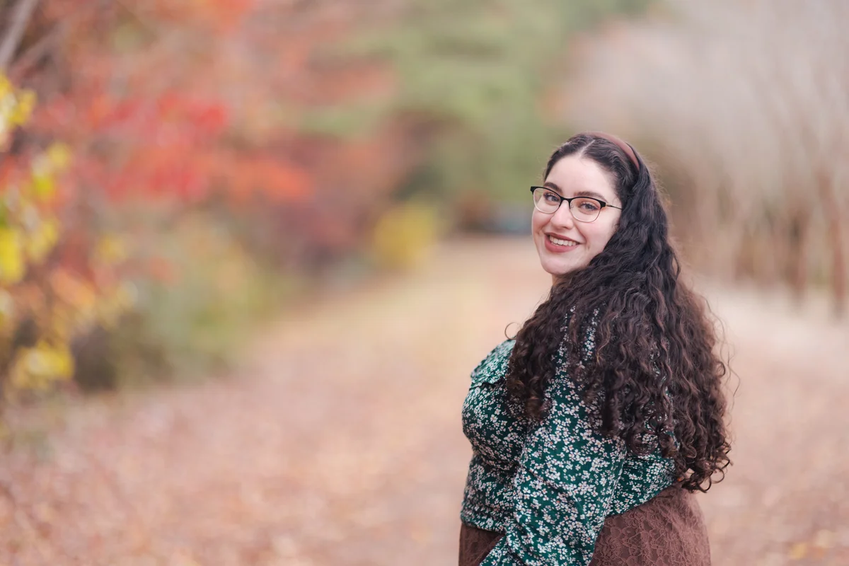 Woman wearing floral blouse and lace skirt