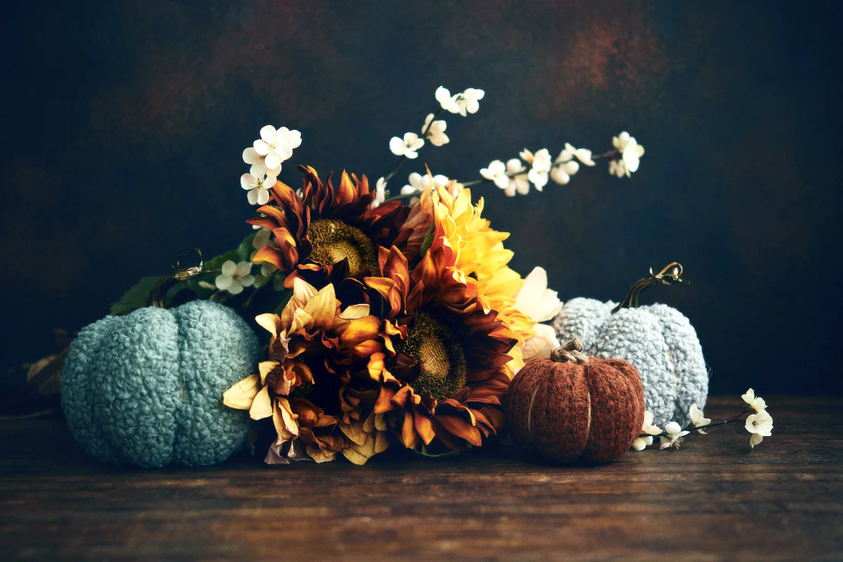 Thanksgiving and fall still life arrangement with sunflower bouquet