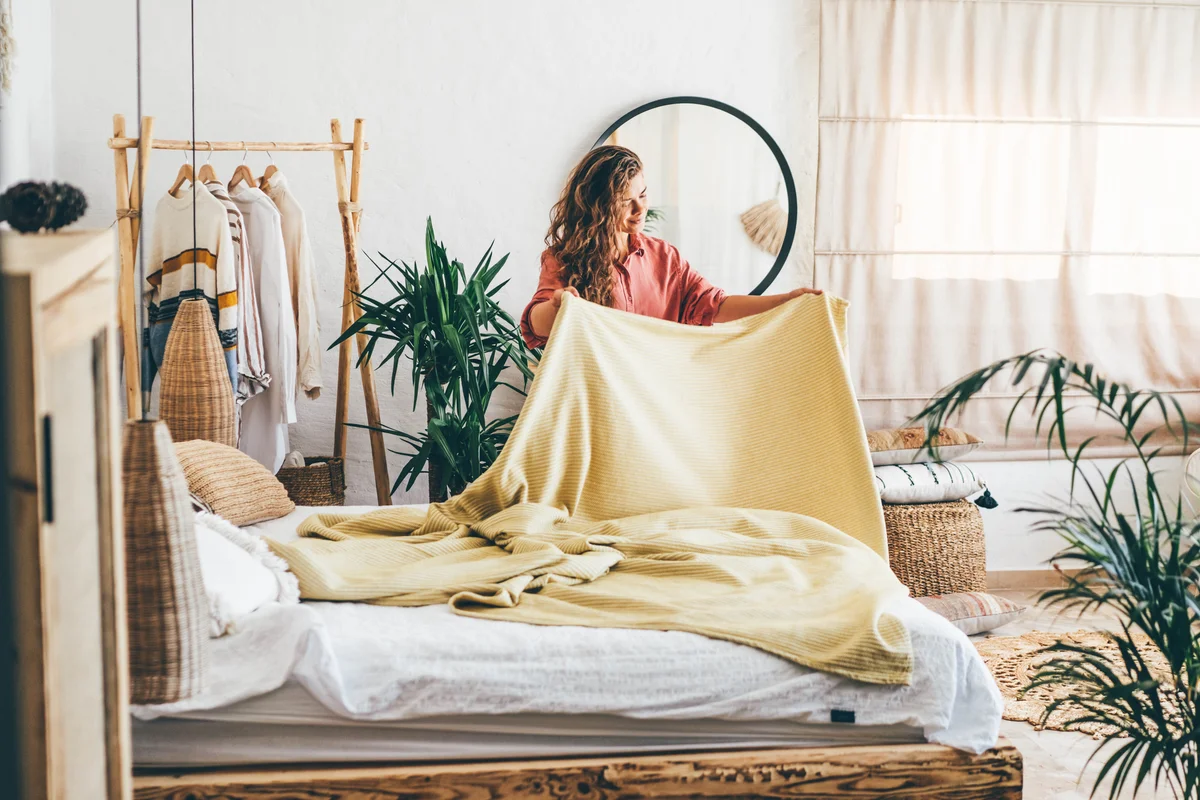 Woman changing sheets